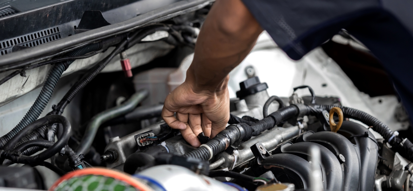 Man repairing car engine